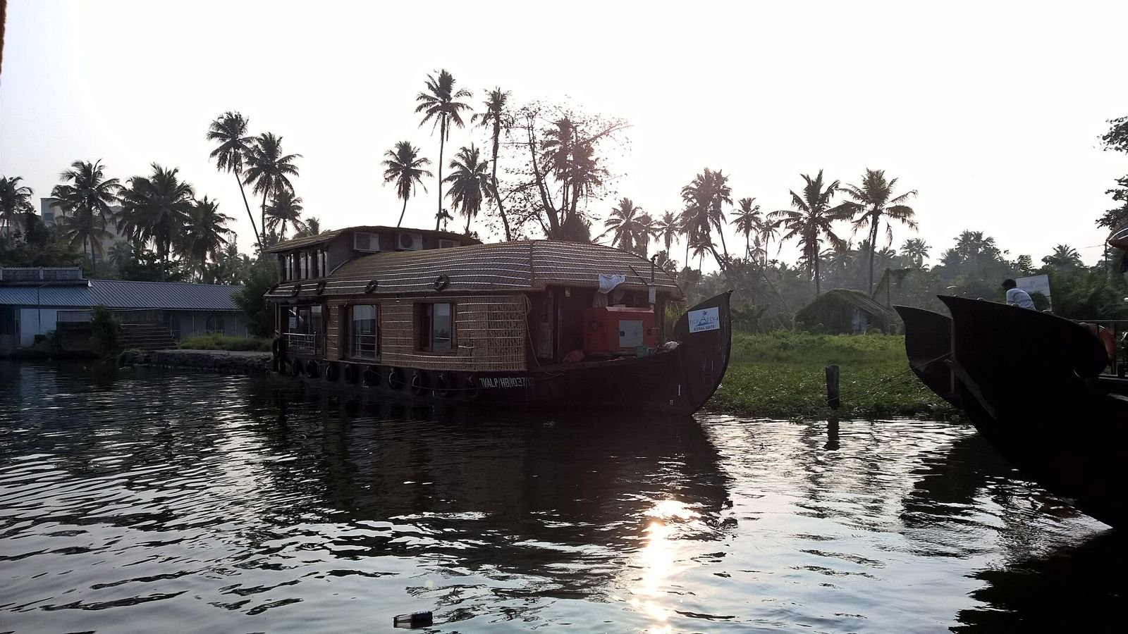 Houseboat moored on the Alleppey backwaters at sunset