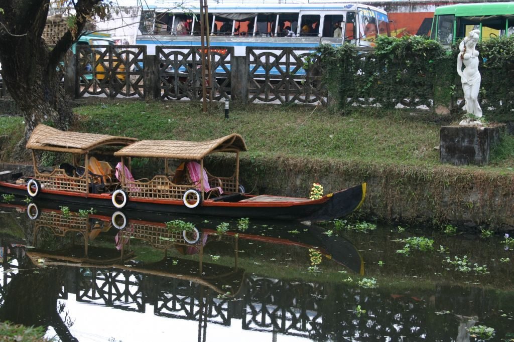 Covered shikara boats moored on a canal at Mullakkal in Alleppey