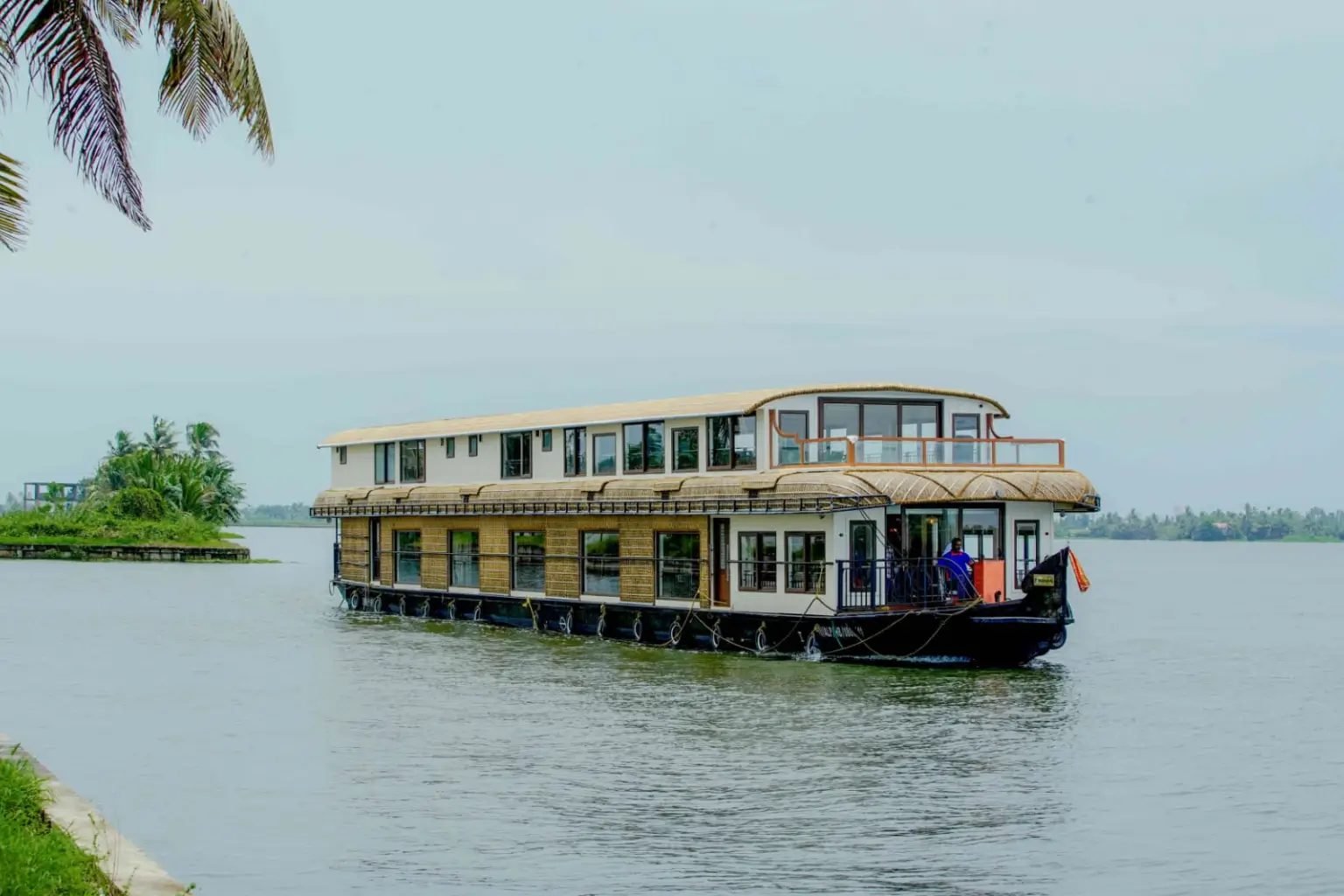 Vembanad Vasantham luxury 7 bedroom double-deck houseboat on open lake water